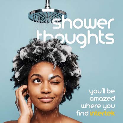 Woman with shampoo bubbles in her hair in the shower